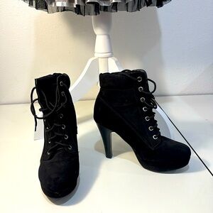 Black high heeled ankle boot lace up